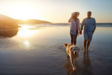 Happy, couple and beach with dog at sunset for outdoor travel, summer holiday and vacation...