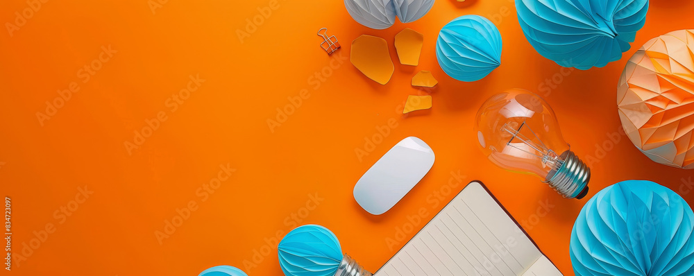 Poster futuristic creative workspace background with blue paper light bulbs, notebook and mouse on orange t