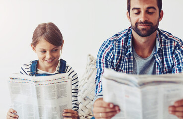 Dad, girl and happy in home with newspaper for updates, reading and child development or growth....