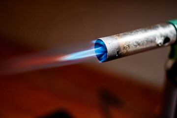 Lit blowtorch with blue flame