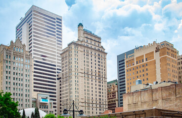 Obraz premium Downtown city buildings and skyscrapers. Photo taken in Dallas Texas on a cloudy day