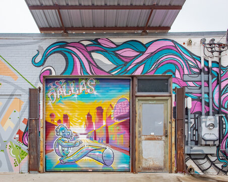 May 6, 2020: Colorful blue and purple urban artwork on a building. Photo taken at Deep Ellum in downtown Dallas Texas