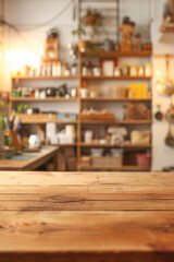 Fototapeta premium A wooden workbench in the foreground with a blurred workshop in the background