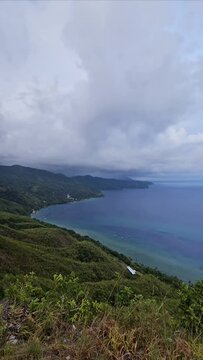 Photo of views of hills and sea from the top of Nusaniwe Paragliding Hill (Bukit Paralayang), Ambon.