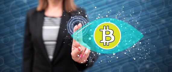 Woman touching a bitcoin concept