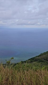 Photo of views of hills and sea from the top of Nusaniwe Paragliding Hill (Bukit Paralayang), Ambon.