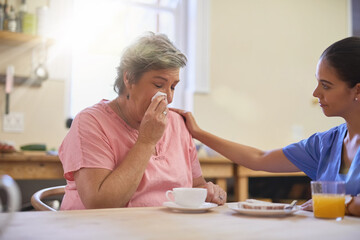 Caregiver, woman and crying for support at nursing home with consultation, medical results or...