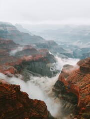 Majestic Grand Canyon Landscape with Mist and Red Rock Formations Perfect for Nature Posters and Travel Promotions