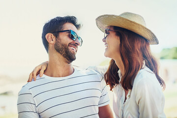 Couple, people and laugh on hug in outdoor with sunglasses for summer holiday, relax and fun in...