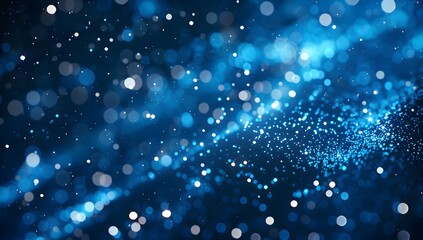 Obraz premium Abstract blue glowing particles background with a bokeh effect 