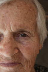 Close-up image of old woman's eye, looking at camera