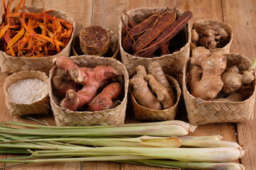 rempah-rempah, spices, ginger, lemongrass, galangal, secang wood, turmeric, tamarind, rice, palm sugar, kencur as ingredients for herbal medicine of the archipelago. Indonesian Spices. rustic table. 