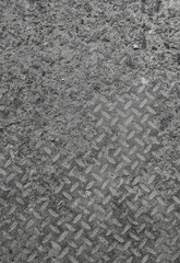 Texture and background of old flat dry concrete surface with diamond pattern and signs of light wearing
