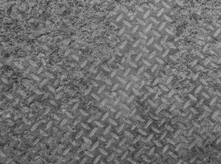 Texture and background of old flat dry concrete surface with diamond pattern and signs of light wearing