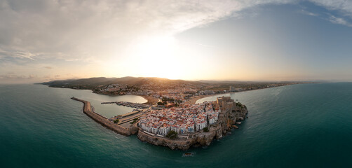Peñíscola, Spain - Aerial Sunset Panorama of the coastline with the Castillo de Peñíscola in...