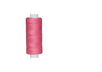 pink spool of sewing thread isolated on white background close up
