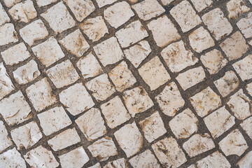 Texture of an calzada on the streets of Lisboa in Portugal. Close up photo.