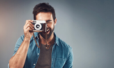 Vintage, camera and man as photographer in studio for photoshoot, creativity and memory. Mockup,...