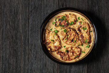 creamy smothered pork chops cooked in onion gravy