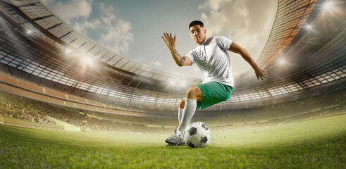 Football world championship. Soccer player running in motion to kicks ball on grassland....
