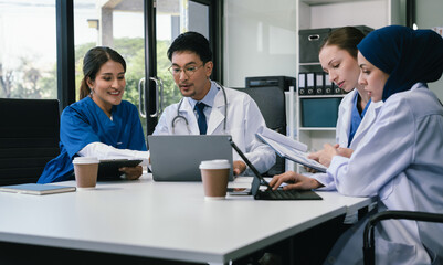 Diversity, Medical team working on digital tablet healthcare doctor technology tablet using computer analyzed the results of medical reports, an online conference at the hospital.