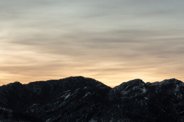 Sunset Over Winter Mountains with Snow.