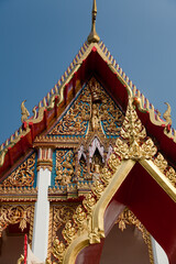 the building is red and white in color and gold decoration