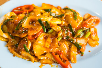 Authentic Thai seafood recipes. Stir fried squid with roasted chili paste. Yummy and exotic food