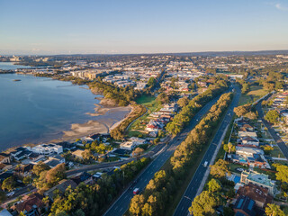 Obraz premium Aerial drone view over Taren Point in Sutherland Shire, Sydney NSW, Australia looking over Taren Point Road toward Caringbah on a sunny morning in May 2024
