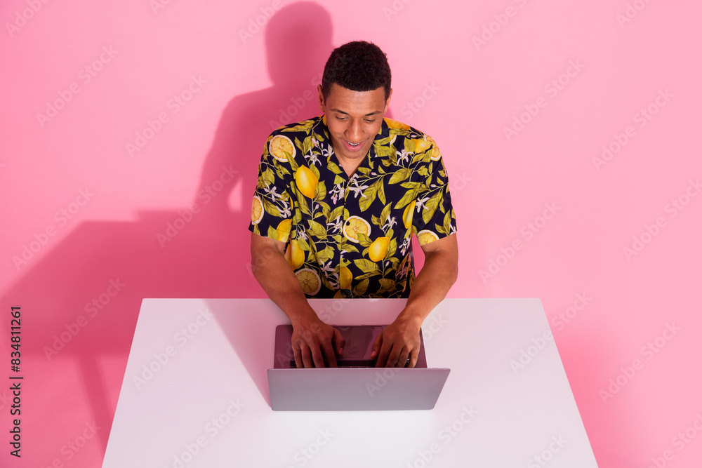 Aufkleber photo of guy sit table desk using netbook writing message isolated pastel color background