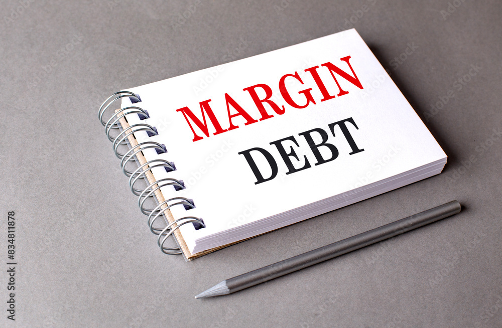 Poster margin debt text on notebook on grey background