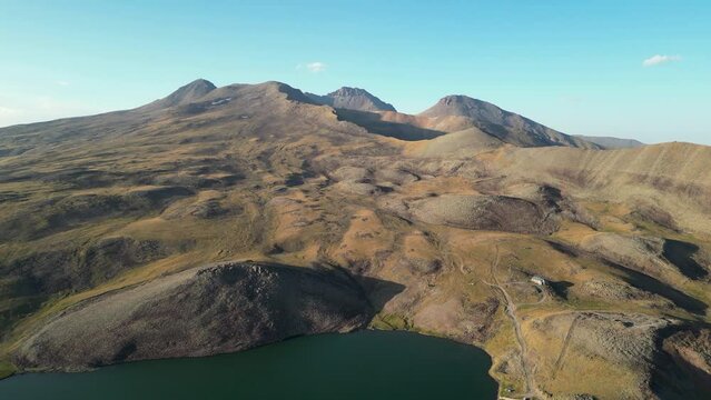 Aerial over Keri Lake in Armenia looks toward Mt Aragats volcano