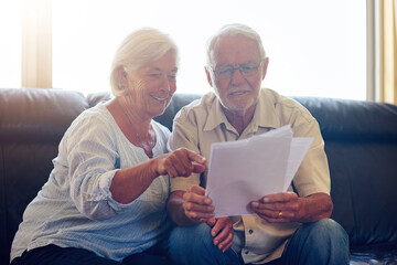 Senior couple, happy and papers in home for budget, mortgage and bank letter together in summer....