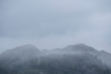 Mystical Mountains Covered By Fog And Clouds.