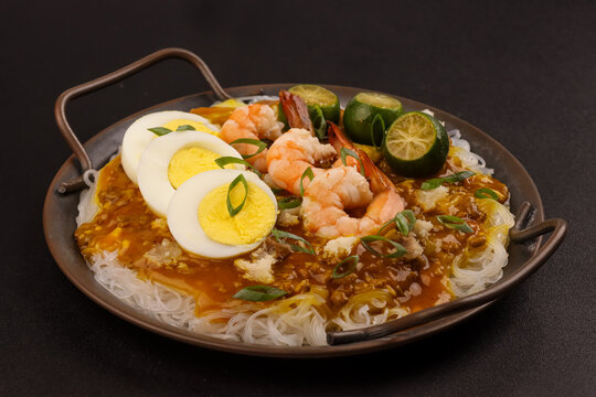 Pancit Palabok is A Noodle Dish With Shrimp Sauce and Topped With Several Ingredients.