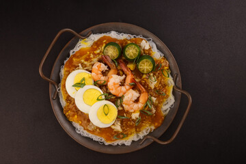Pancit Palabok is A Noodle Dish With Shrimp Sauce and Topped With Several Ingredients.