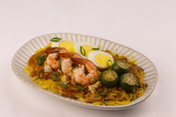 Pancit Palabok is A Noodle Dish With Shrimp Sauce and Topped With Several Ingredients.