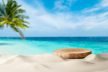 Wooden pedestal with free space for your decoration on tropical summer sand beach