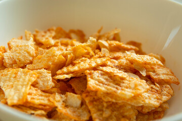 Close up of salty flavored chips in a bowl
