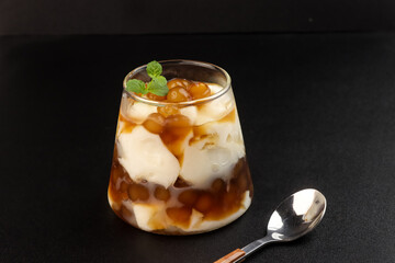 Taho is a Filipino Sweet Dessert Consisting of Silken Tofu, Simple Syrup and Tapioca Pearls.