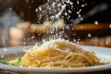 A side view image of grated parmesan cheese being generously sprinkled over a plate of steaming spaghetti pasta - Powered by Adobe