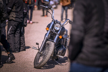 Motorcycle standing among people at a biker show