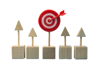 a group of wooden cubes with a red target and arrow on top