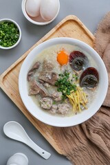 Congee or rice porridge with pork and eggs, thai food, asian food, chinese food