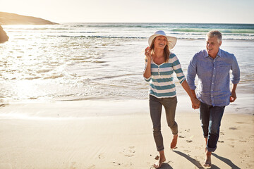 Mature couple, holding hands and portrait at ocean on holiday, travel and summer sunshine on...