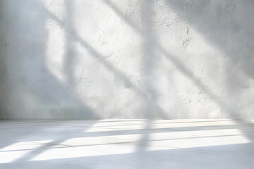 Minimal abstract light gray background for product presentation. Shadow and light from windows on plaster wall.