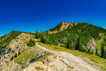Scenic dirt path along rocky mountain slope
