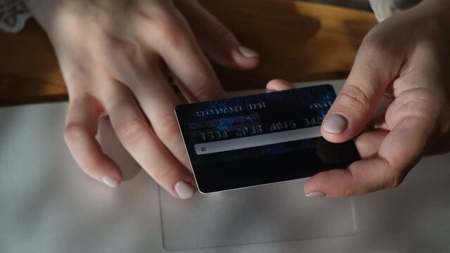 Hands input card security code to make online purchase. 