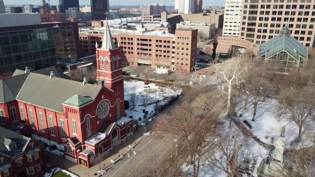 Birds Flying in Washington Square Park Across from Church in Downtown Rochester, New York