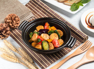 King Oyster Mushroom Meal with wheat, spoon and fork served in broth isolated on napkin side view of taiwanese food
